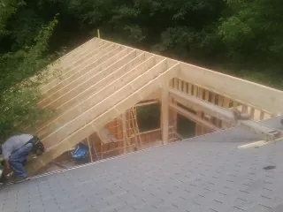 Framing a new roof addition that ties into an existing shingle roof in New Vienna
